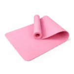 Rolled-up pink TPE yoga mat on a white background.