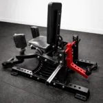 Close up of GravoMax hip abductor machine thick ergonomic padding and 50mm Olympic plate sleeves