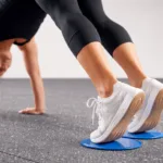 Core slider on gym flooring tiles for home workout sliding exercises