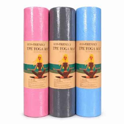 Three rolled-up eco-friendly TPE yoga mats in pink, grey, and blue