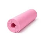 Close-up of a pink TPE yoga mat showing the non-slip wave texture.