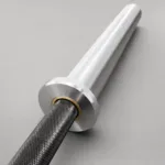 Detailed close-up of Olympic barbell sleeve, collar and knurled shaft with premium metal finish